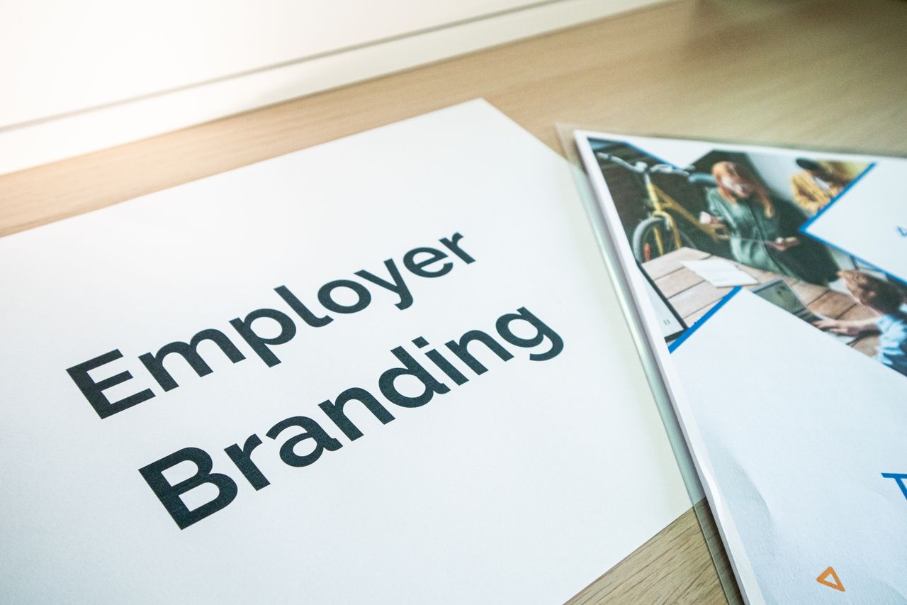 services-01 Focus on employer branding with documents on a wooden desk, ideal for business concepts.