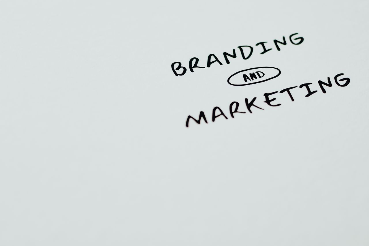 services-02 A minimalist image featuring the words Branding and Marketing on a white background, ideal for digital marketing themes.